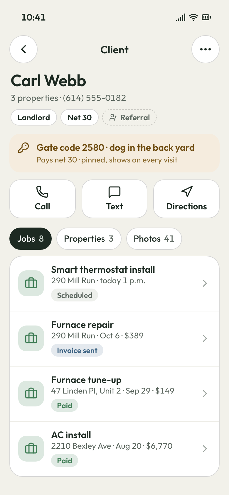 Phone app client page for a landlord: tags, a pinned gate and net 30 note, Call, Text, Directions and jobs by rental